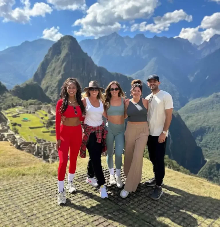 European and Latin American tourists in a single Machu Picchu postcard to remember