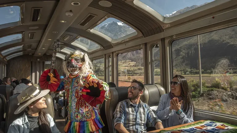 The interior of a tourist train with passengers enjoying the ride, ideal for supporting the section about train travel to Machu Picchu and the overall travel experience.